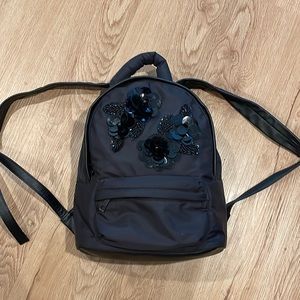 Adorable small backpack  like new with inner and outer pocket- like new